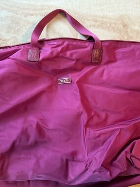 TUMI VOYAGER “JUST IN CASE” NYLON TRAVEL TOTE IN RASPBERRY